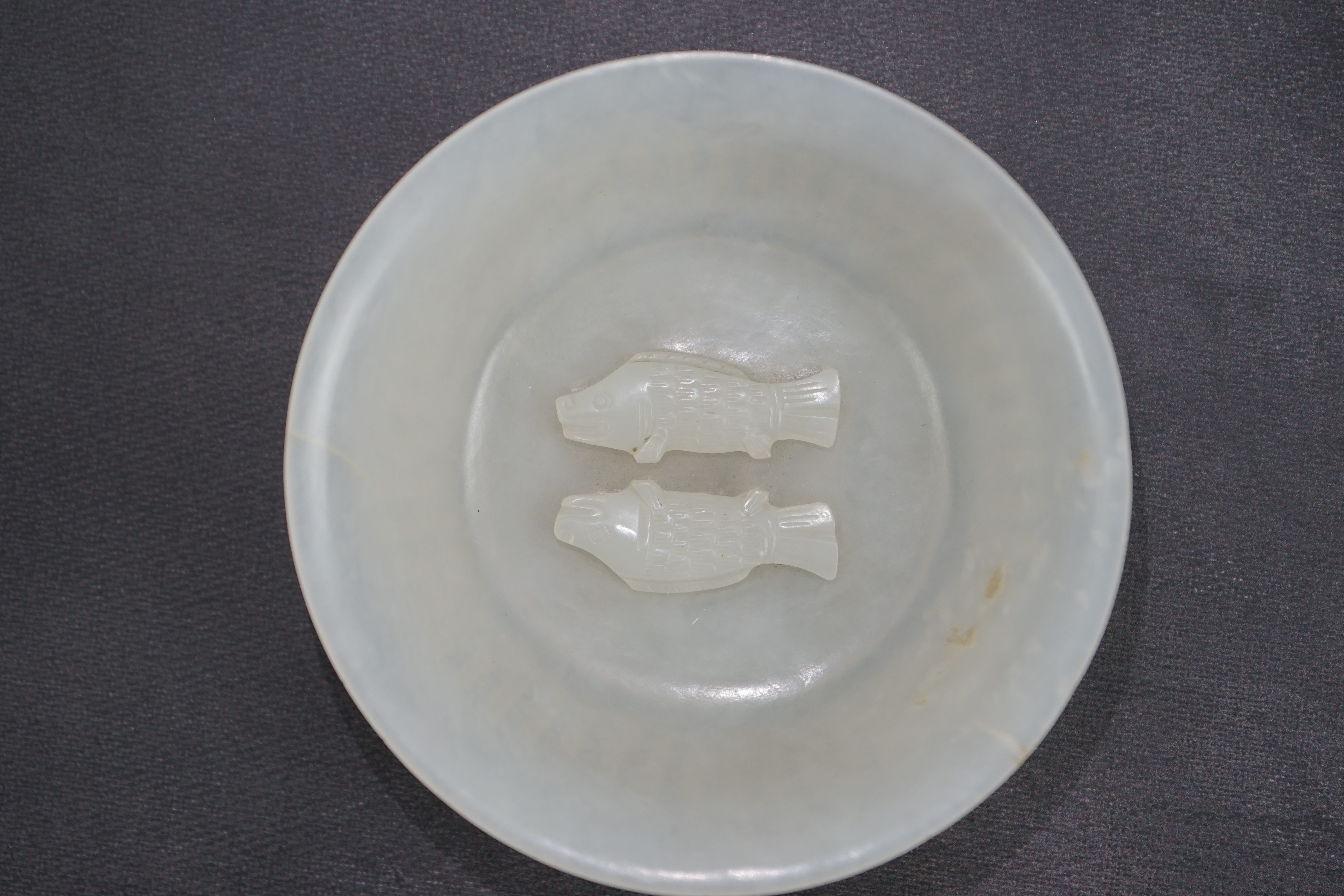 A fine Chinese white jade 'twin-fish' bowl, Qianlong period (1736-95)